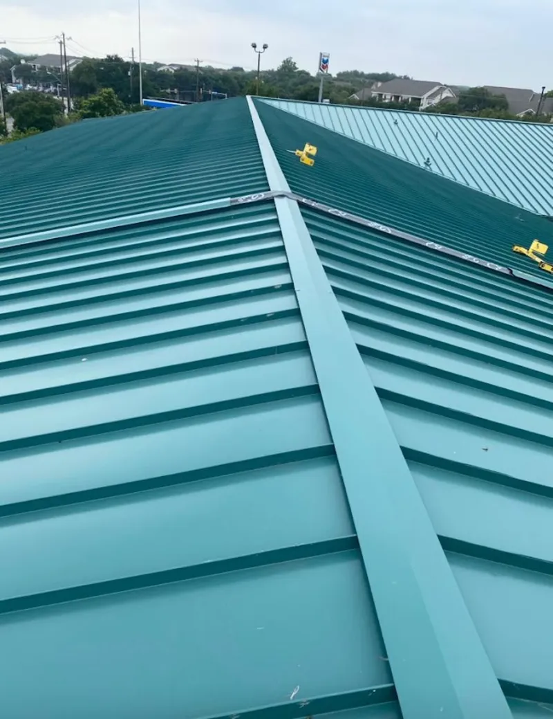 Green commercial metal roof ridge and valley for Metal Roof Repair in Milton